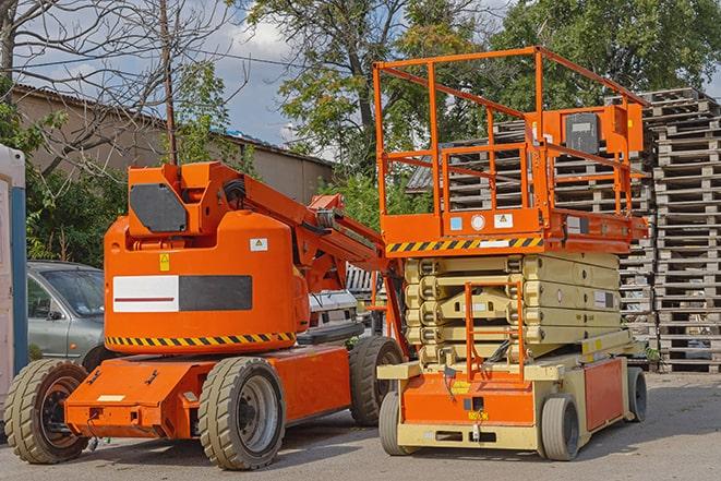 heavy-duty forklift maneuvering through a busy warehouse in Calverton