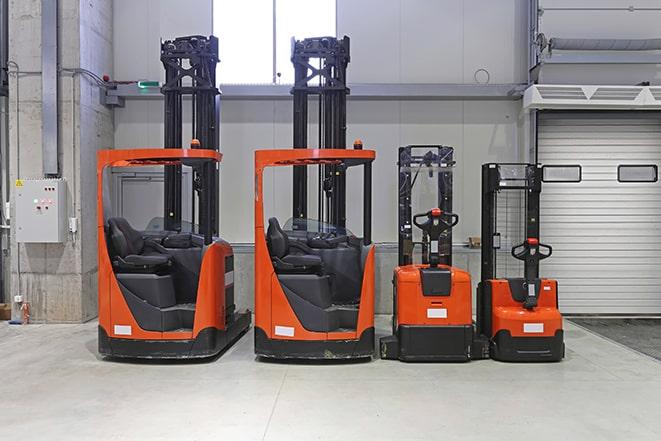 a cluster of forklifts in a warehouse setting